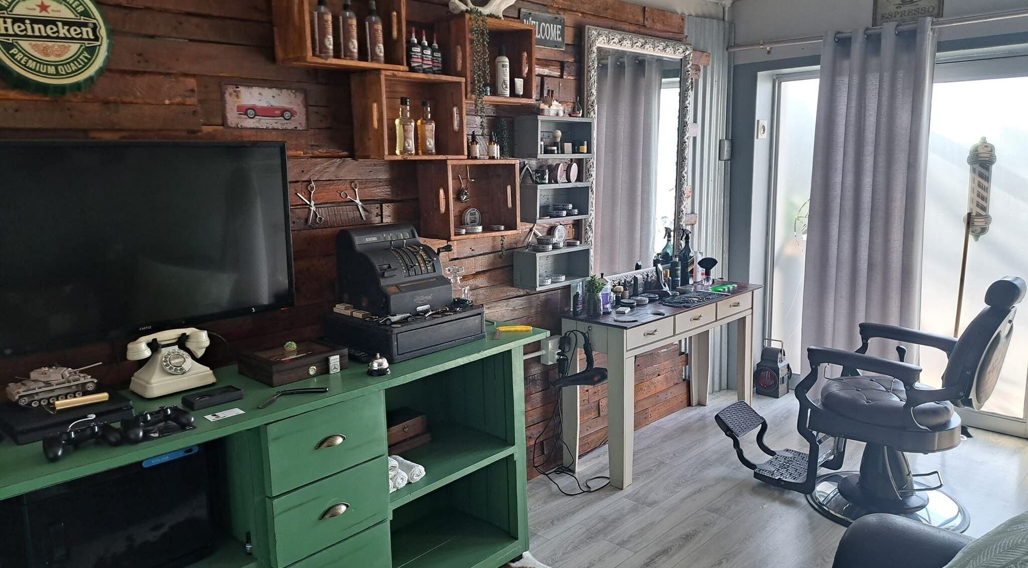 Charming interior of Barber James in East London, Eastern Cape, ZA with vintage decor and classic barber chair.