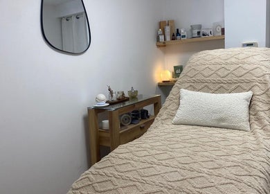 Relaxing treatment room at The Ultimate Touch Beauty in Wymondham, England, GB with plush decor.