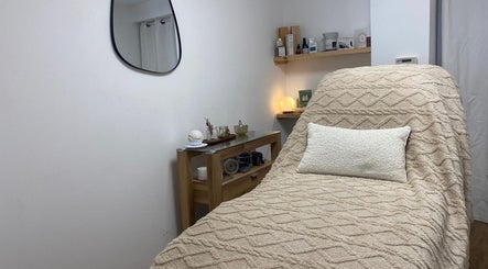 Relaxing treatment room at The Ultimate Touch Beauty in Wymondham, England, GB with plush decor.