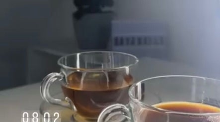 Two glass teacups of herbal tea at dayanailscuracao, Willemstad, Curaçao, CW, offering relaxation and warmth.
