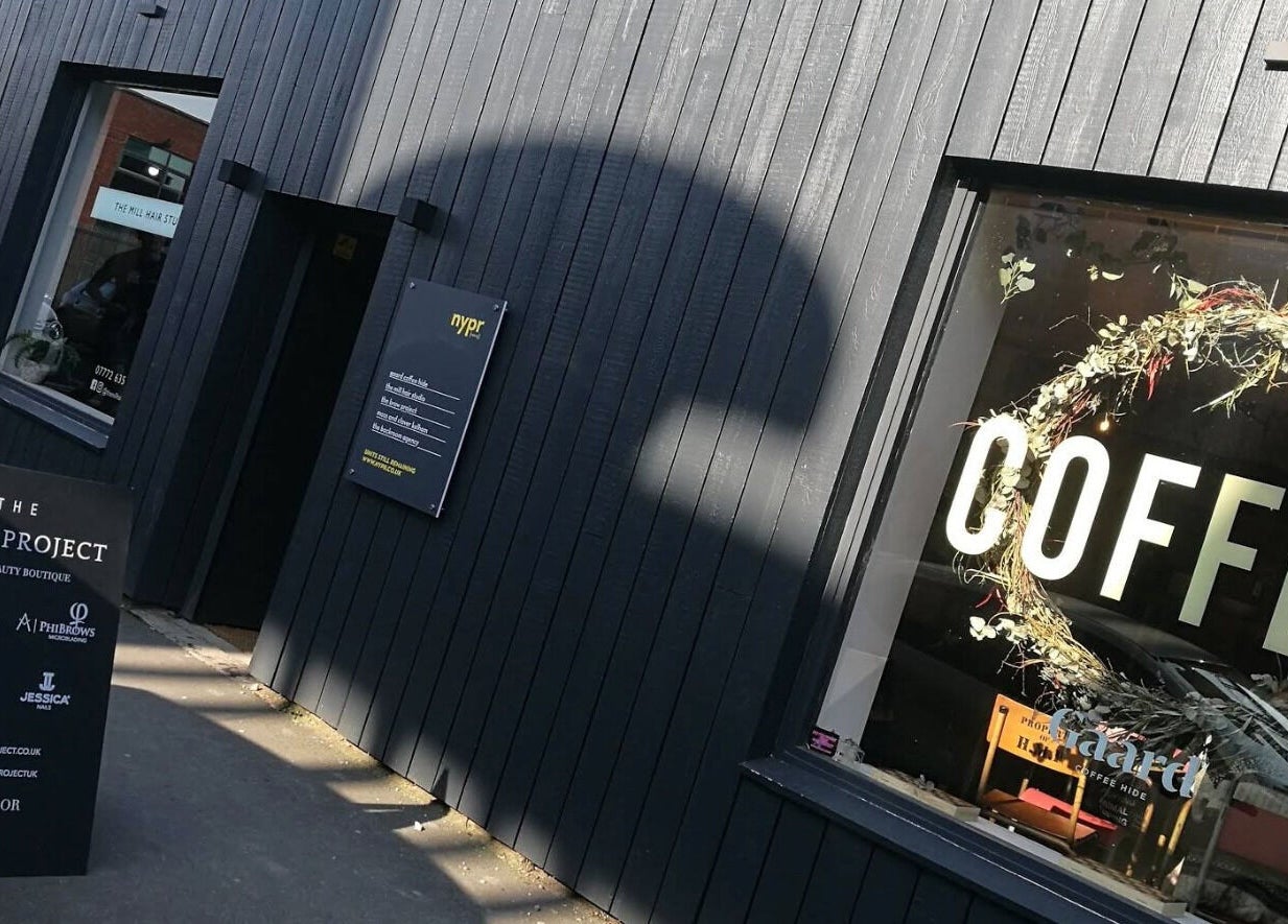 Exterior of The Brow Project in Sheffield, England, GB showcasing its sleek design and welcoming sign.