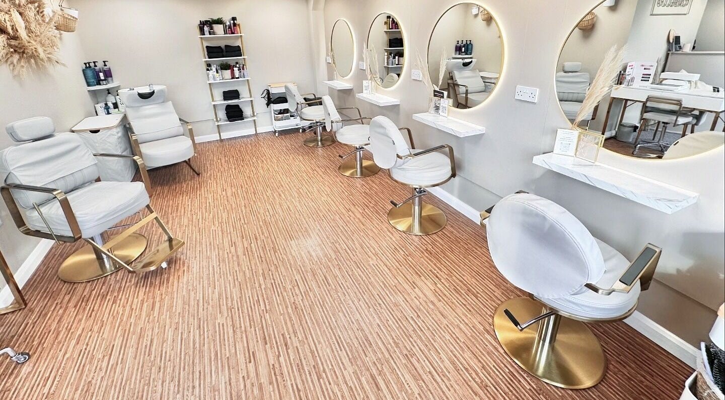 Modern salon chairs at Cabello Hair Beauty & Aesthetics, Sudbury, England, GB reflect a sleek, inviting style.