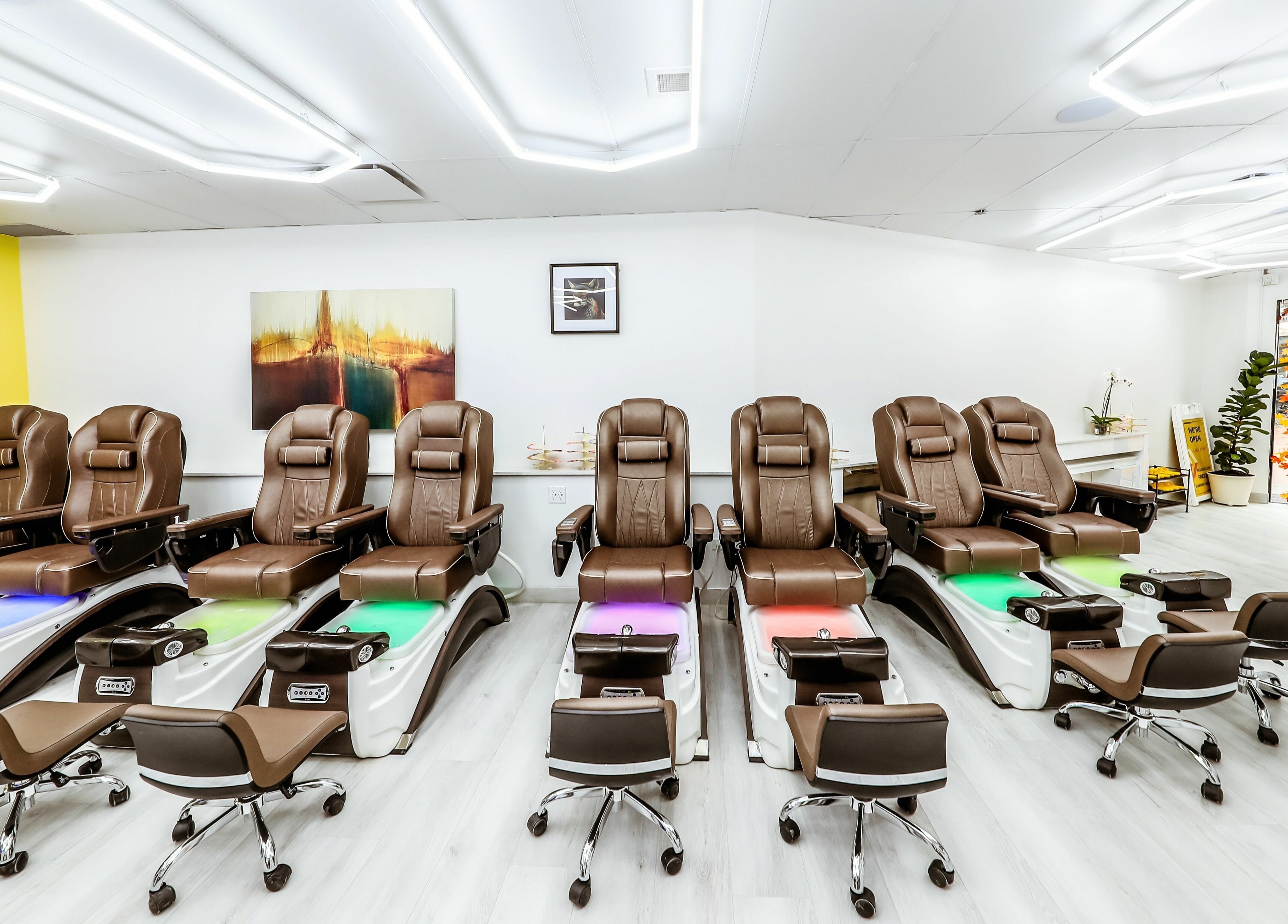 Luxurious pedicure chairs at A Nail Story, Calgary, Alberta, CA, offering a serene spa experience.
