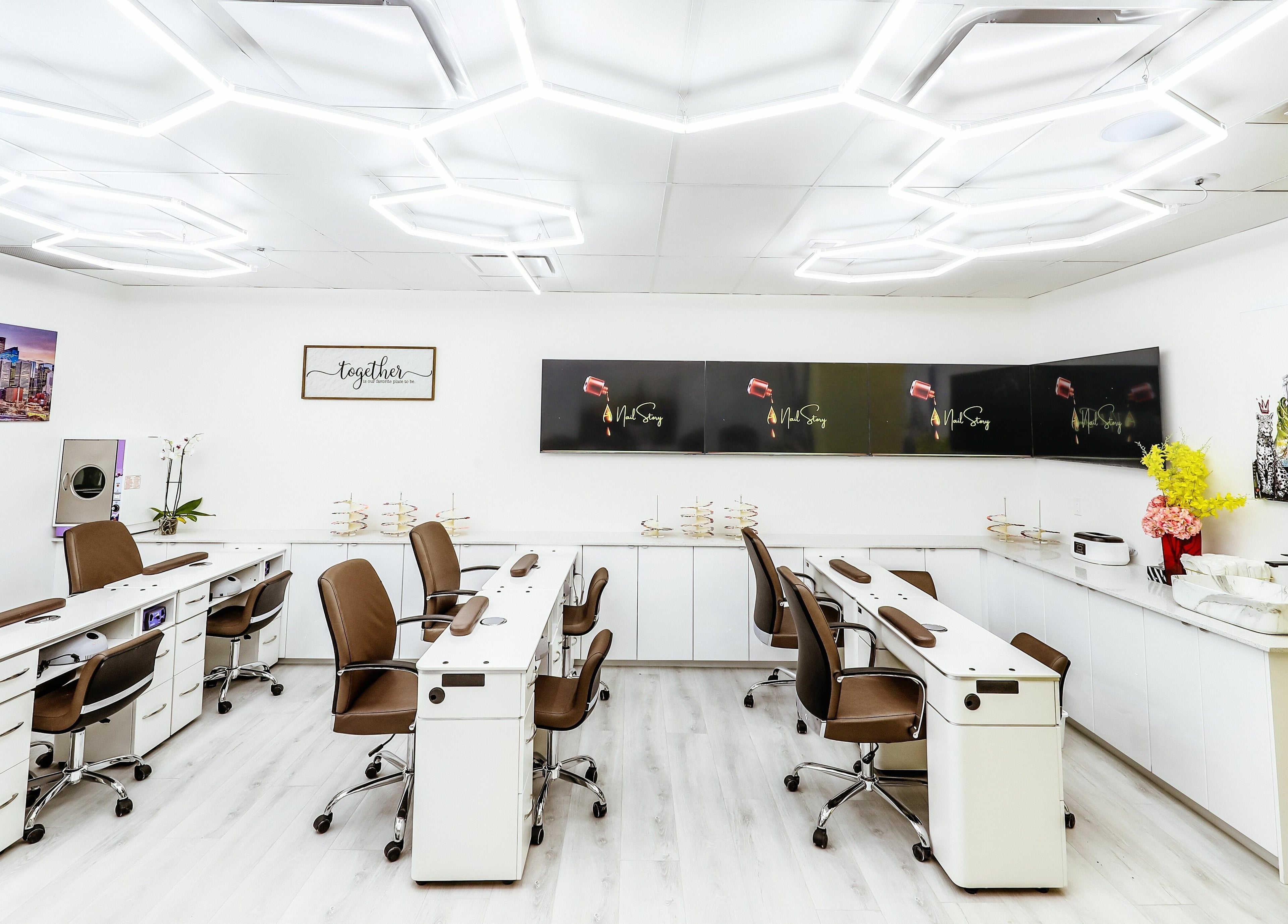 Modern nail studio interior at A Nail Story, Calgary, Alberta, CA, with stylish workstations and elegant decor.