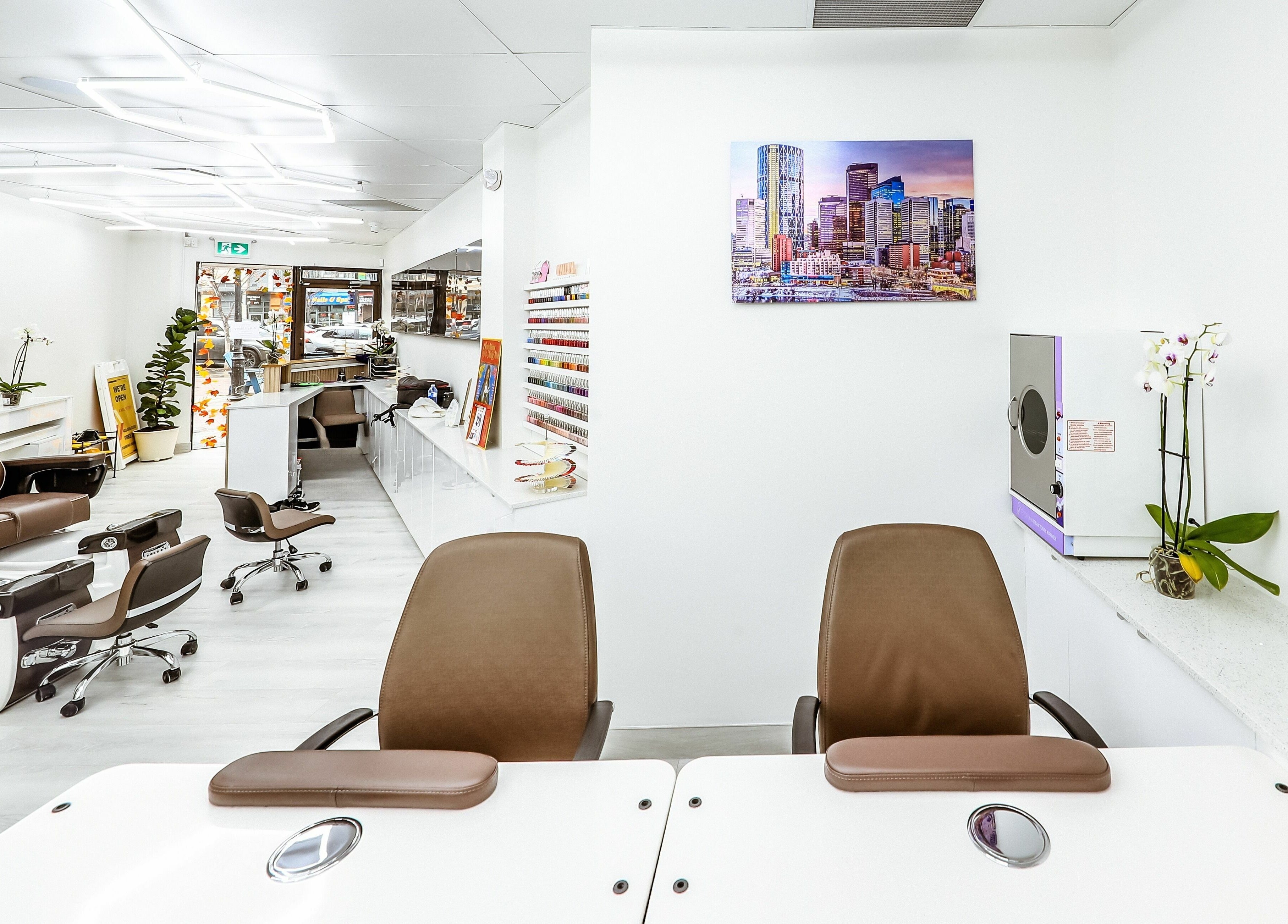 Modern, chic interior of A Nail Story in Calgary, Alberta, CA, featuring stylish manicure stations and decor.