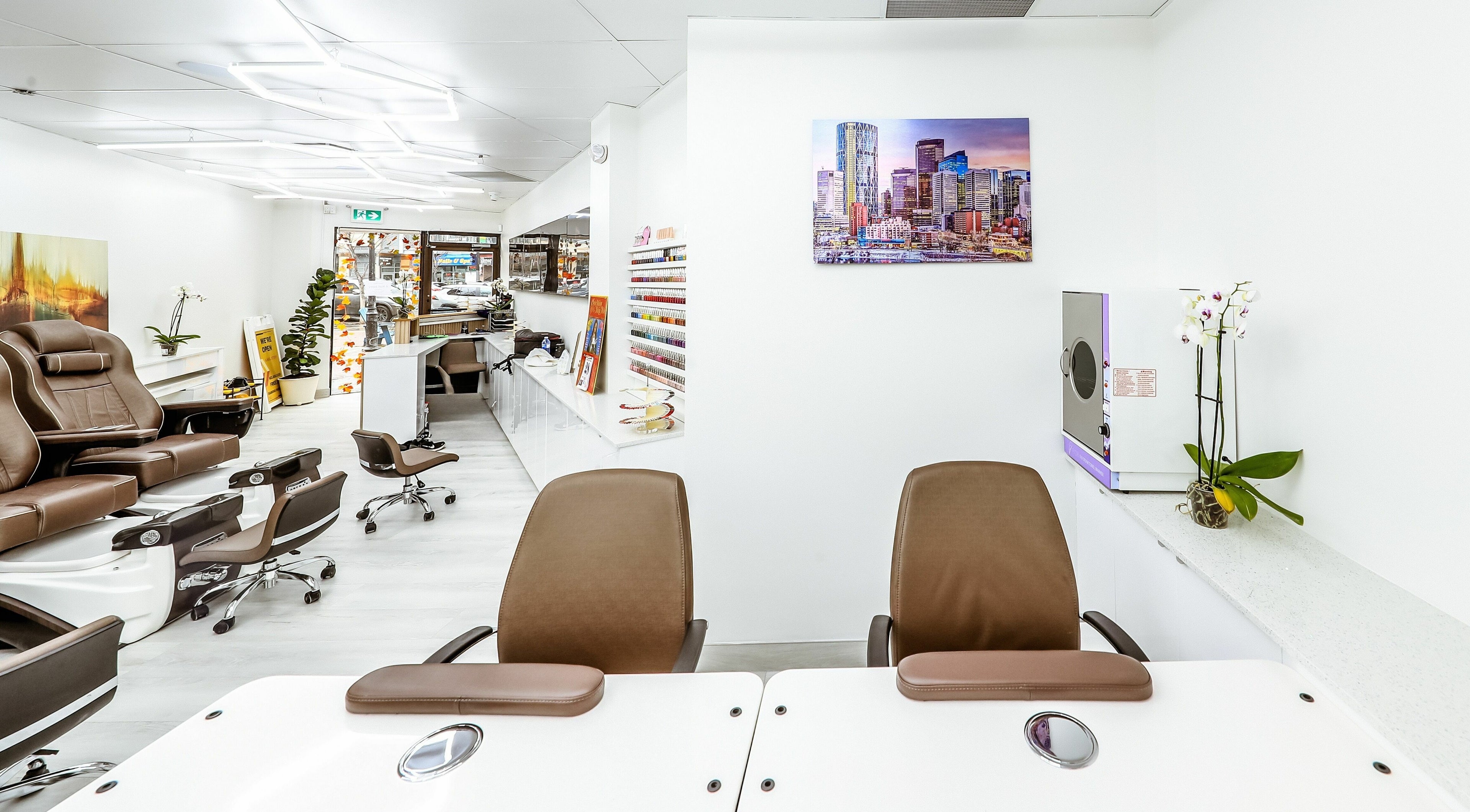 Modern, chic interior of A Nail Story in Calgary, Alberta, CA, featuring stylish manicure stations and decor.