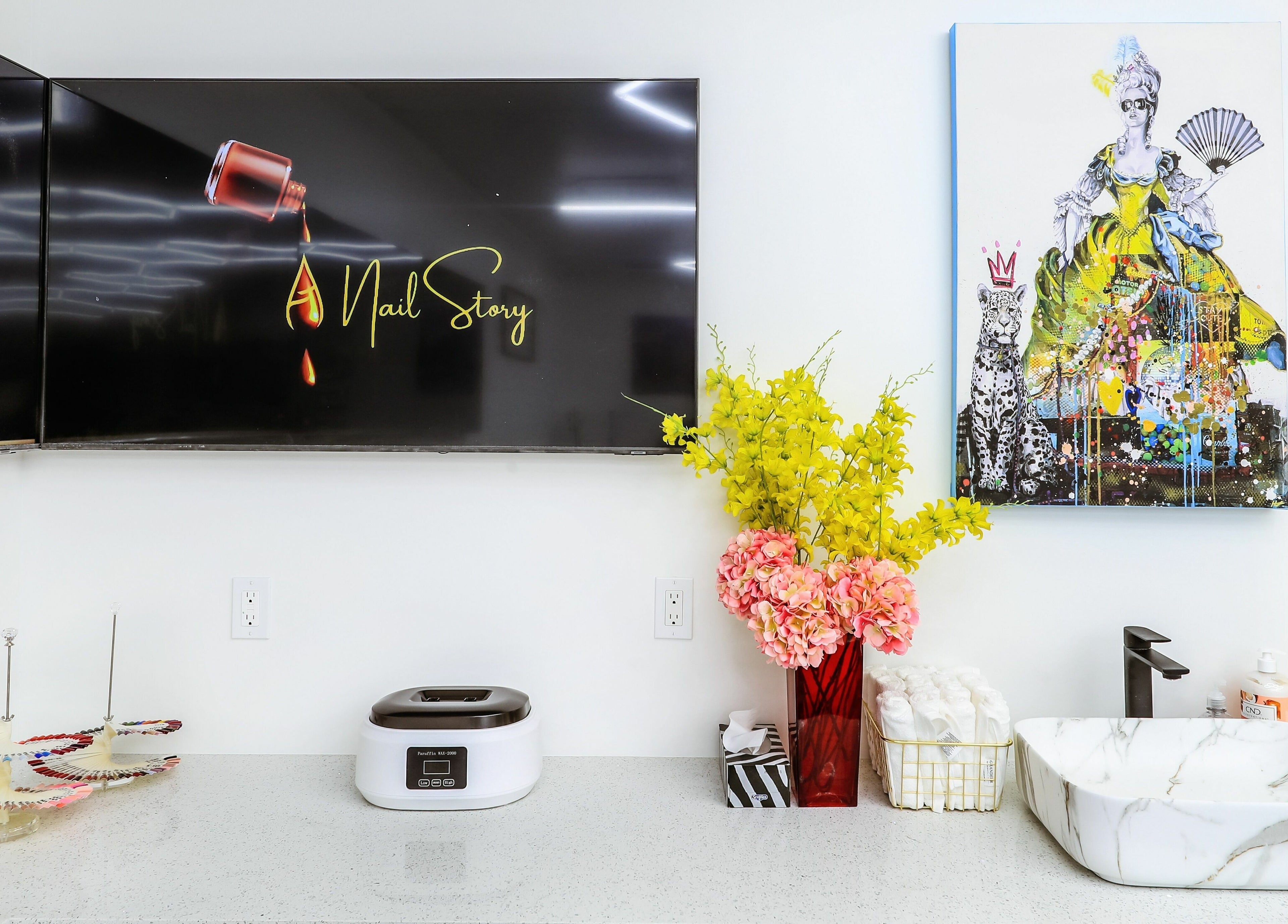 Artistic decor and nail colors enhance the chic atmosphere at A Nail Story in Calgary, Alberta, CA.