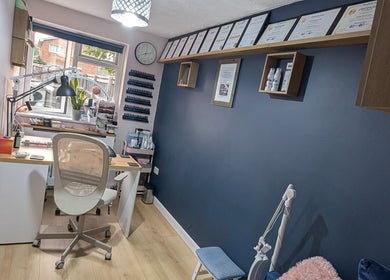 Professional beauty setup at Trulyou, Swindon, England, GB with certificates on display and modern decor.