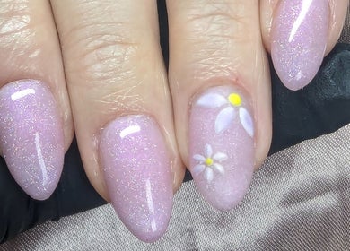 Elegant floral nail art at Trulyou, Swindon, England, GB, featuring shimmering pastel pink and daisy designs.