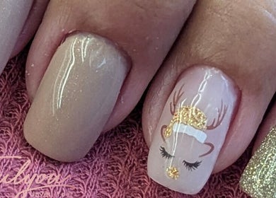 Festive nail design at Trulyou, Swindon, England, GB featuring reindeer art on glittery nails.