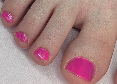 Bright pink toenail polish showcased at Trulyou, Swindon, England, GB enhancing beauty and wellness.