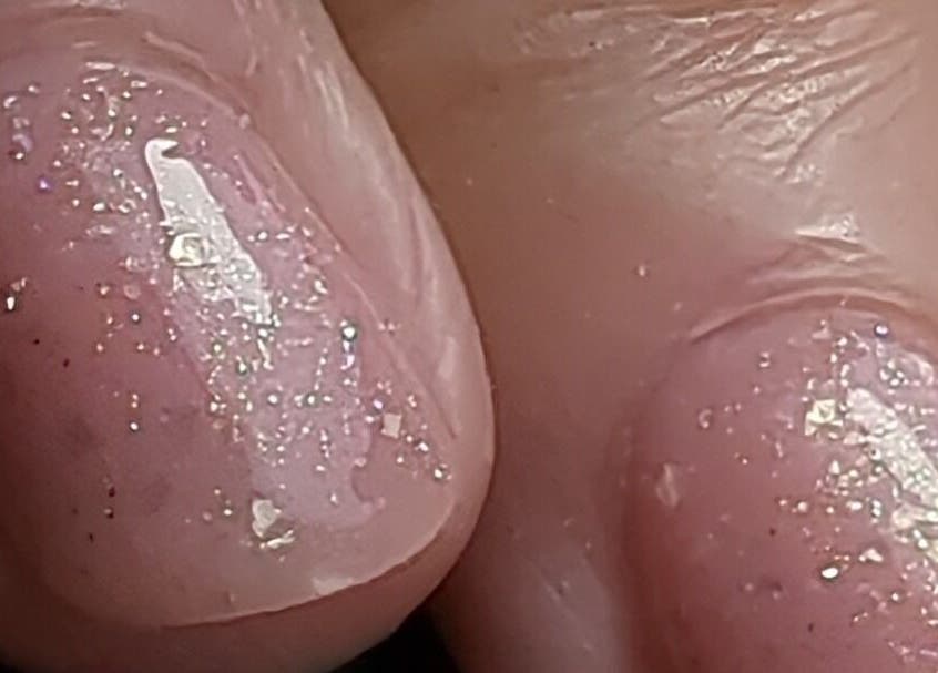 Close-up of glittery finished nails at Trulyou in Swindon, England, GB.