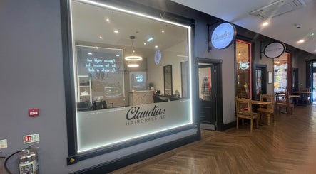 Front view of Claudia & Co Hairdressing in Warrington, England, GB, showcasing a modern and inviting salon design.