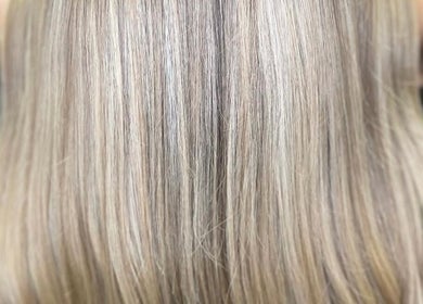 Smooth blonde hair at Claudia & Co Hairdressing in Warrington, England, GB, showcasing a sleek and stylish result.