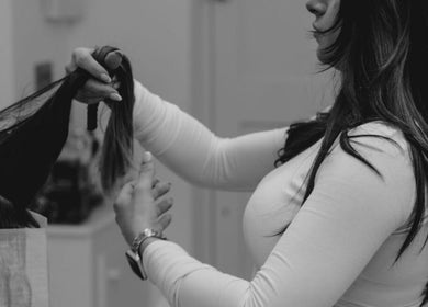 Stylist working on client's hair at Claudia & Co Hairdressing, Warrington, England, GB.