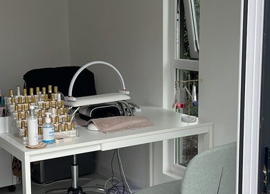 Manicure station with nail polishes at Maddie's Beauty Room, Great Baddow, England, GB.