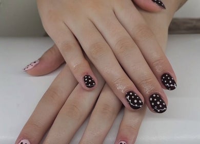 Elegant polka dot nail art at Maddie's Beauty Room, Great Baddow, England, GB.
