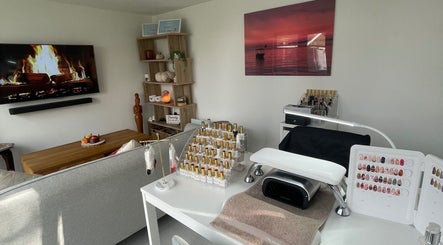 Elegant nail care setup in Maddie's Beauty Room, Great Baddow, England, GB with cozy decor and polish display.