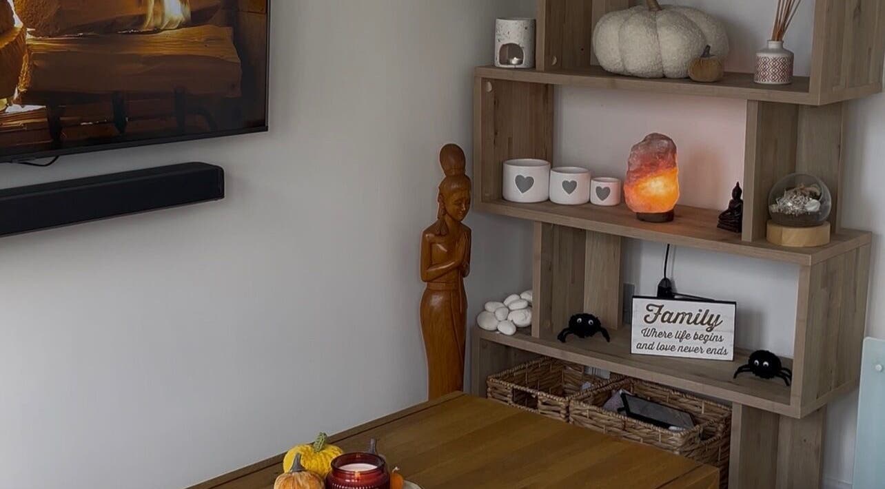 Cozy decor in Maddie's Beauty Room, Great Baddow, England, GB, featuring wooden statue and salt lamp.
