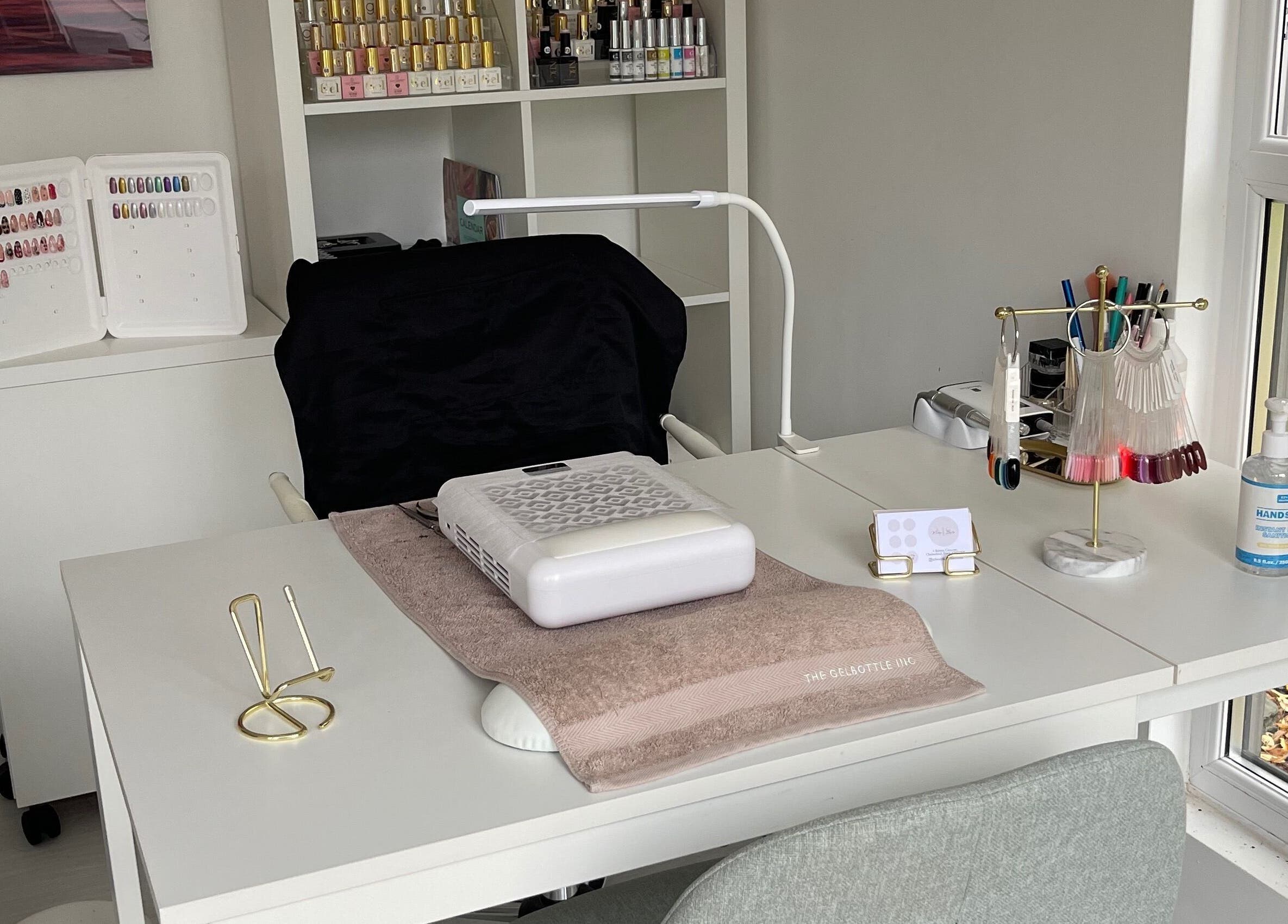Nail station at Maddie's Beauty Room, Great Baddow, England. Elegant setup with nail tools and products.