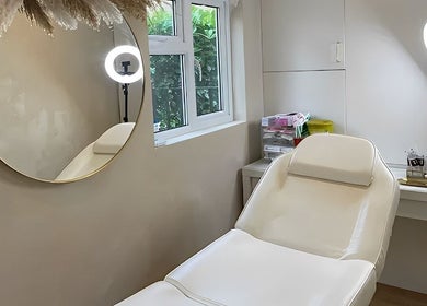 Relaxing treatment room at Abbigail Richards Hair, Makeup & Aesthetics in Reading, England, GB, featuring a comfortable chair.