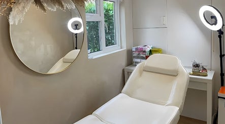 Relaxing treatment room at Abbigail Richards Hair, Makeup & Aesthetics in Reading, England, GB, featuring a comfortable chair.