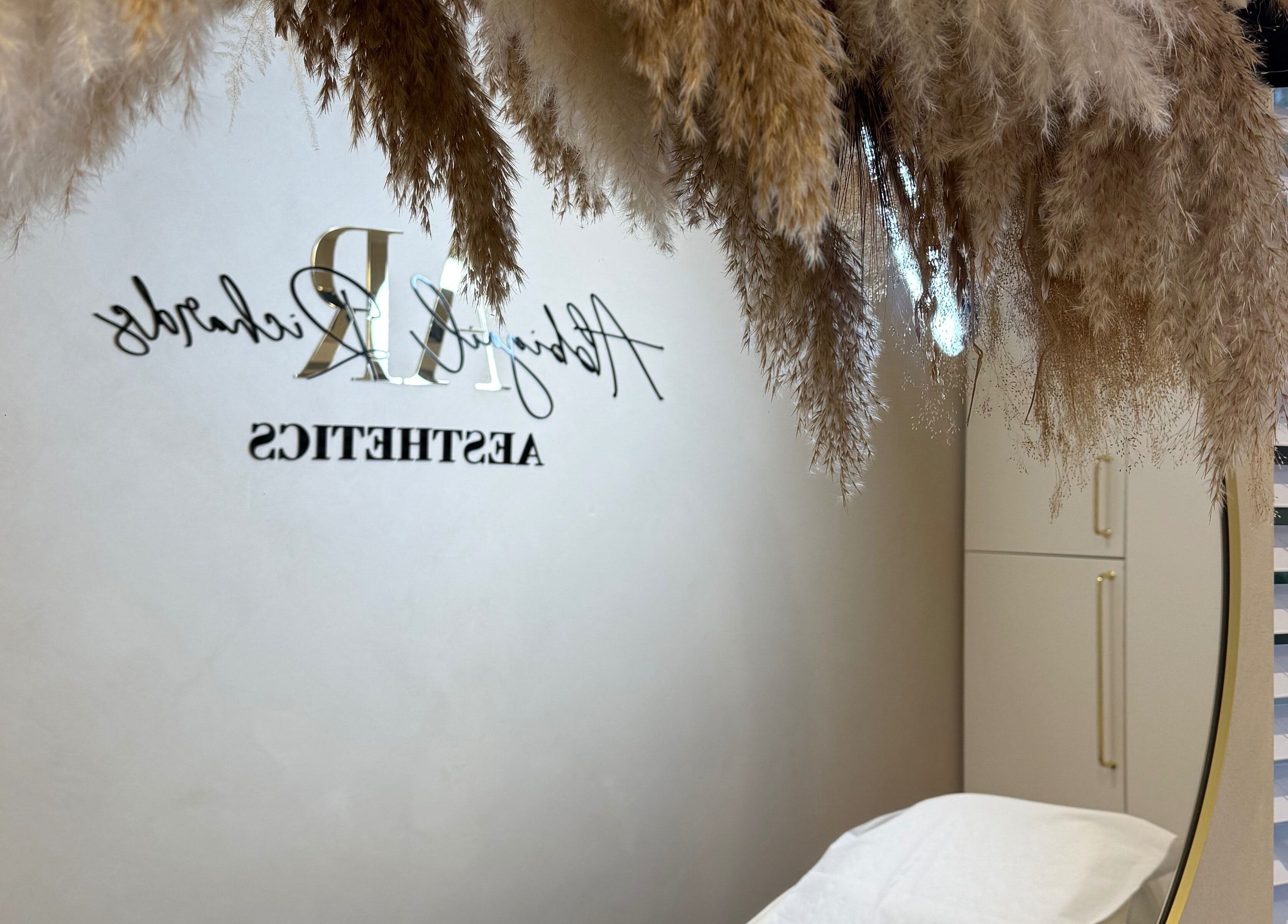 Elegant interior at Abbigail Richards Hair, Makeup & Aesthetics in Reading, England, GB with pampas grass decor.