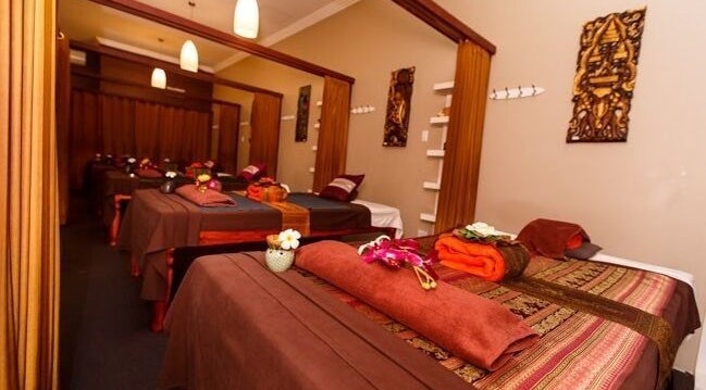 Relaxing massage room at Siam Tara Thai Massage and Spa, Double Bay, New South Wales, AU with warm decor.