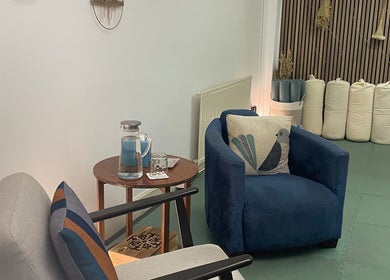 Serene seating area at Calmer Being, Edinburgh, Scotland, GB, featuring plush chairs and soothing decor.