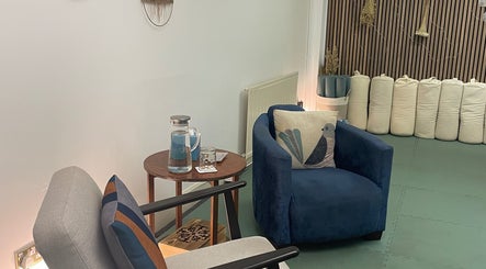 Serene seating area at Calmer Being, Edinburgh, Scotland, GB, featuring plush chairs and soothing decor.