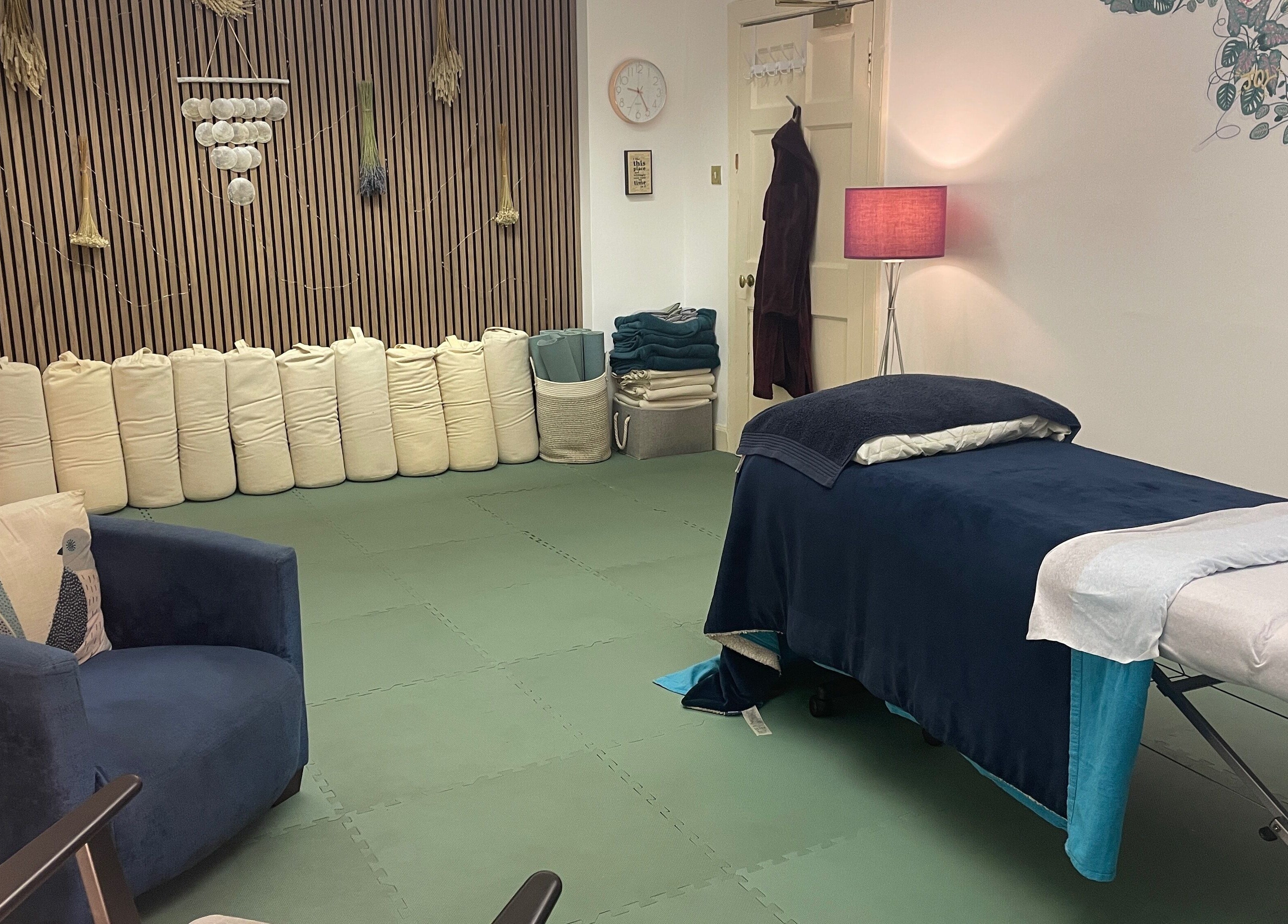 Tranquil therapy room at Calmer Being, Edinburgh, Scotland, GB with a cozy massage table and calming decor.