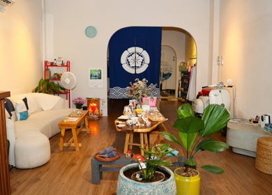 Cozy interior of The Spa Saigon in Thành Phố Hồ Chí Minh, VN, featuring elegant decor and lush plants.