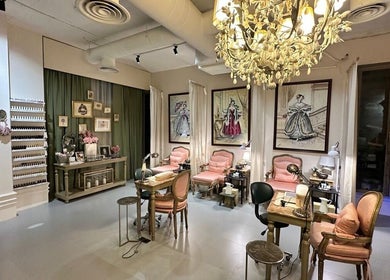 Luxurious nail salon at Four Branches Spa Beauty, Riyadh, with plush seating and elegant décor.