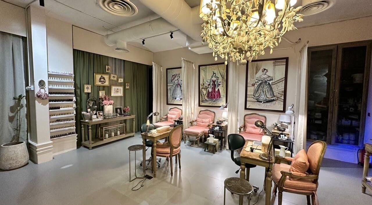 Luxurious nail salon at Four Branches Spa Beauty, Riyadh, with plush seating and elegant décor.