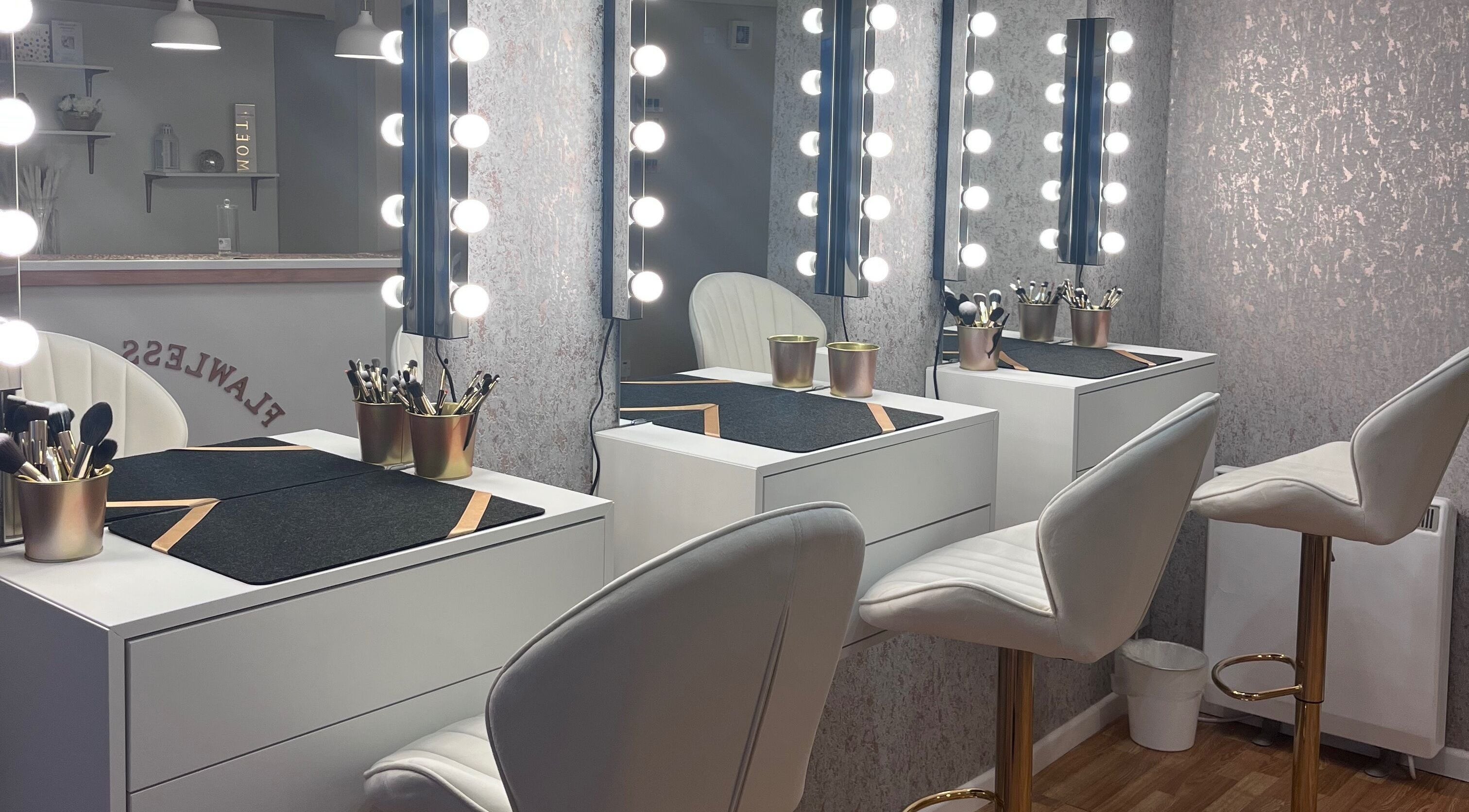 Elegant makeup station at Flawless Beauty, Athlone, County Westmeath, IE with illuminated mirrors.