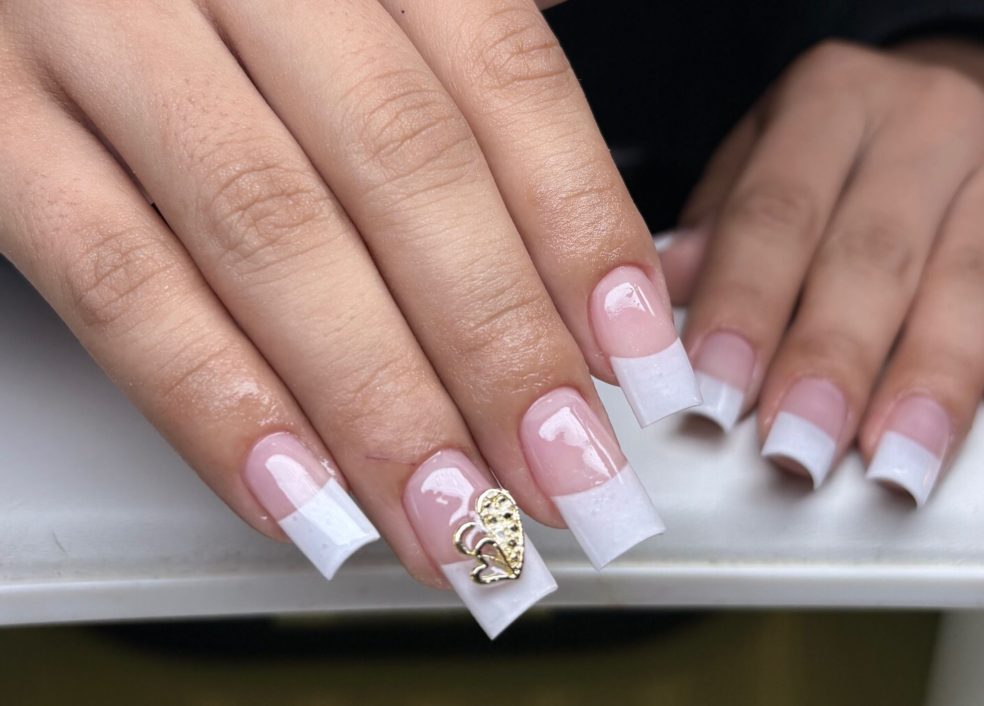 French manicure with gold detail at NSNails+ in Tampa, Florida, US.