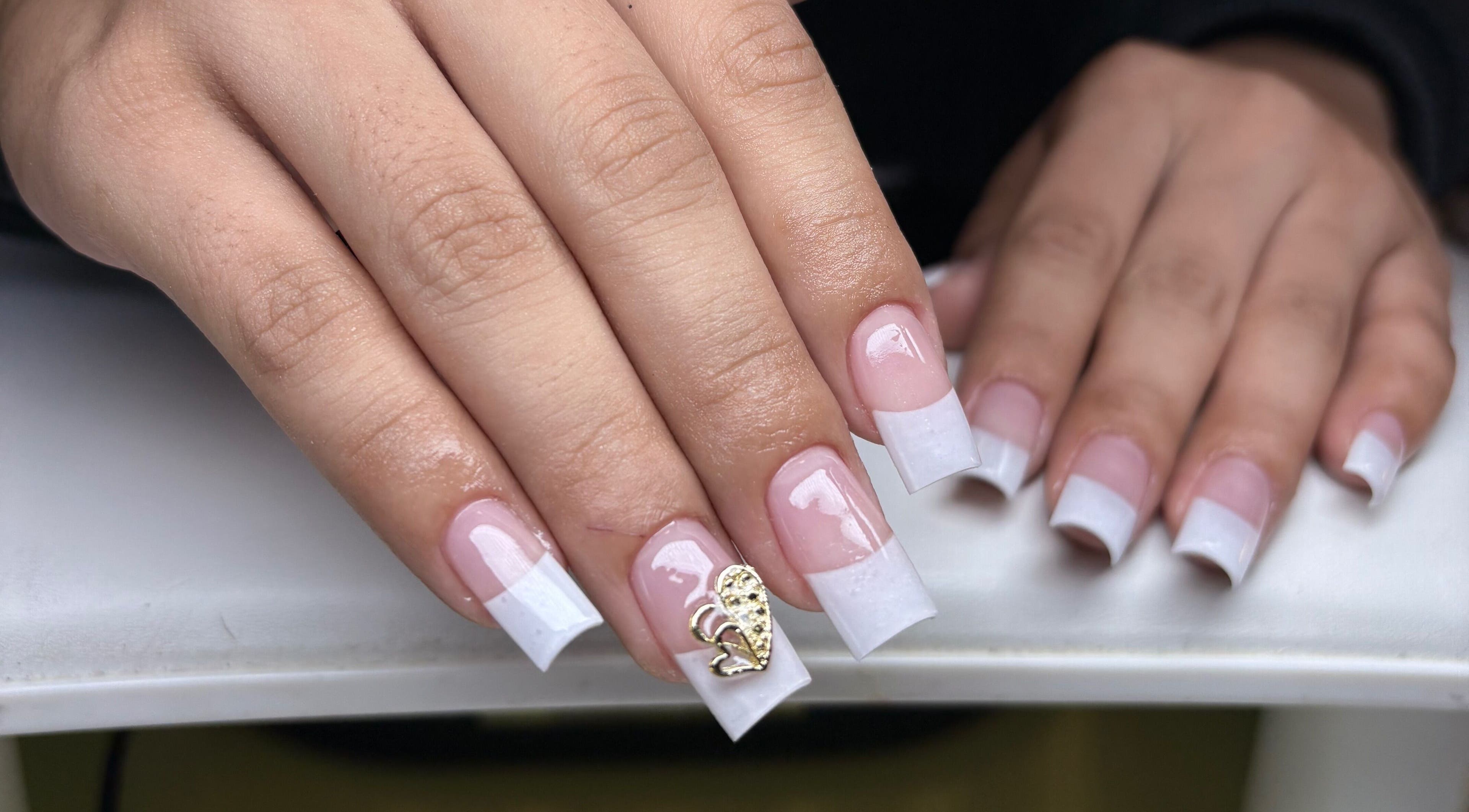 French manicure with gold detail at NSNails+ in Tampa, Florida, US.