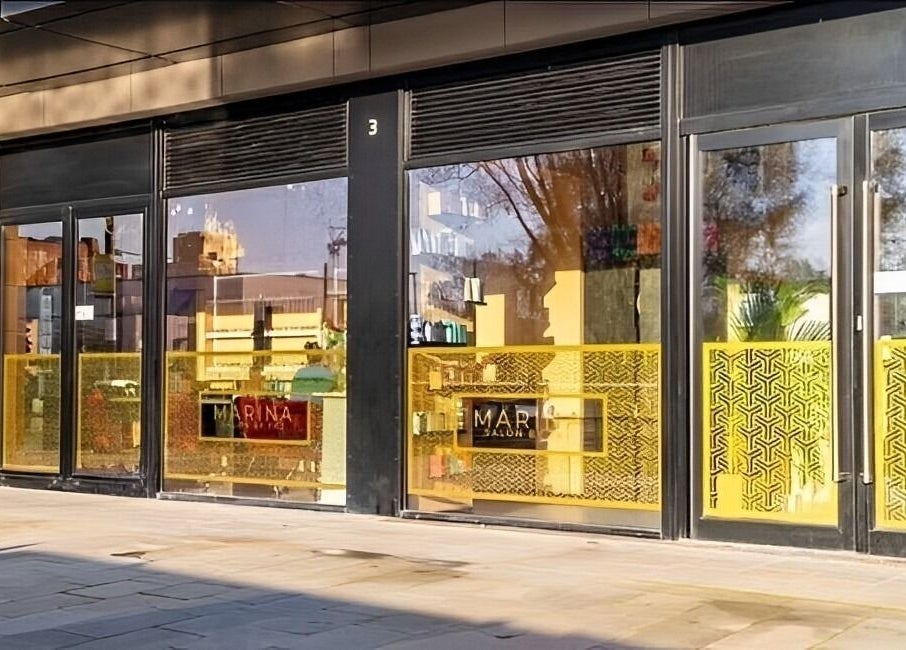 Street view of Zen Aesthetics Mcr in Manchester, England, GB with modern glass front.