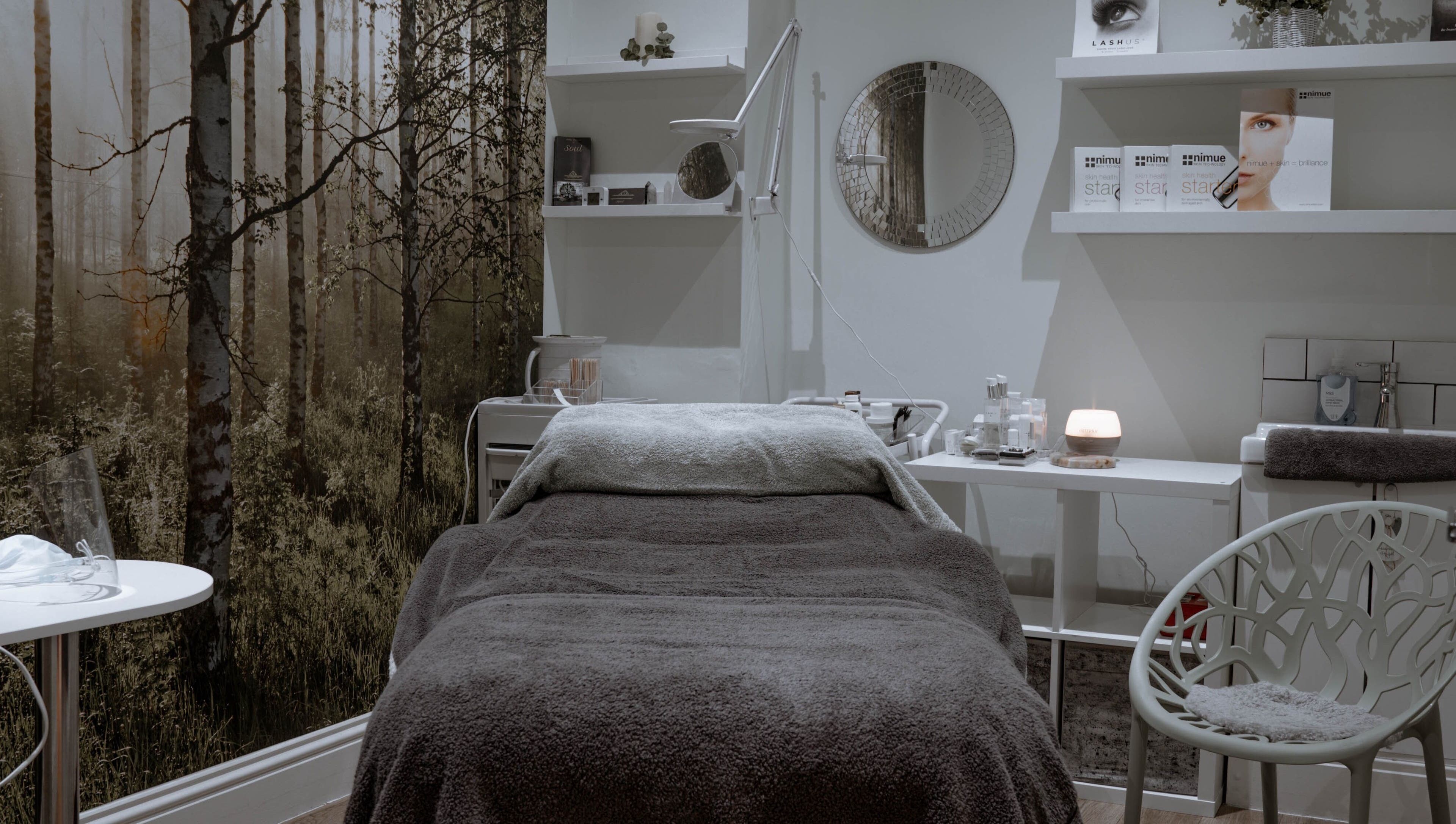 Calming therapy room at Kelly at Soul Self Care Clinic, Harrogate, England, GB with serene forest mural.