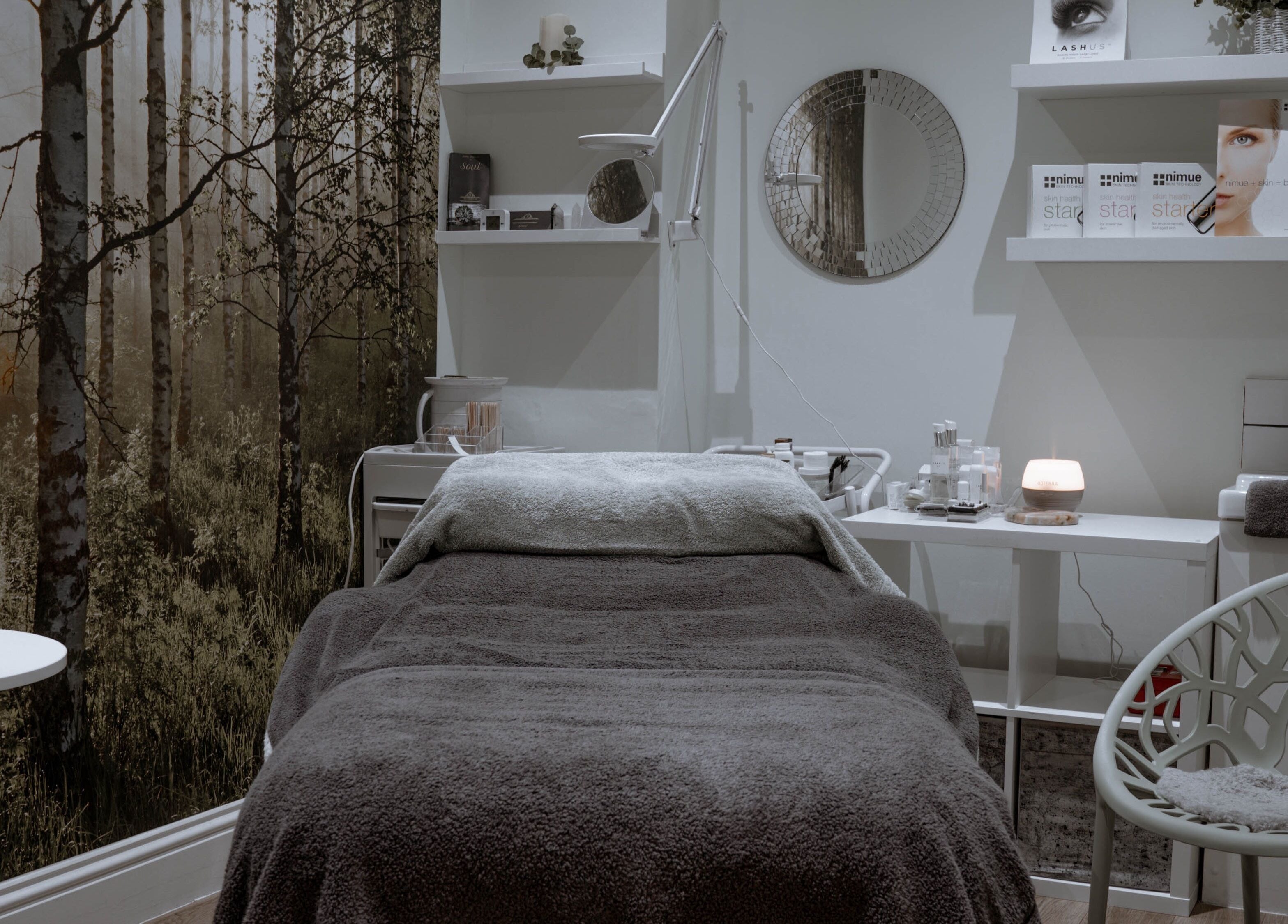 Calming therapy room at Kelly at Soul Self Care Clinic, Harrogate, England, GB with serene forest mural.