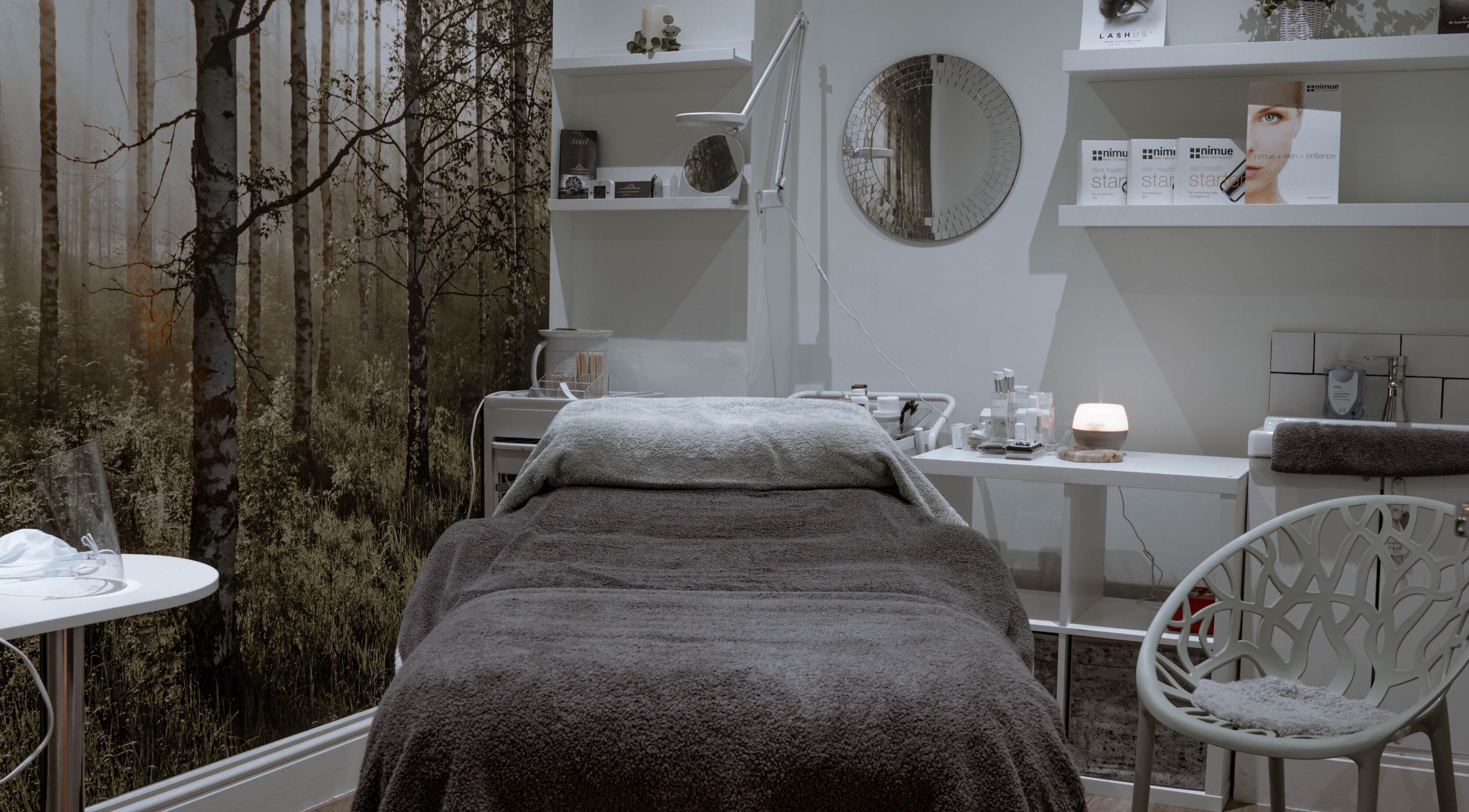 Calming therapy room at Kelly at Soul Self Care Clinic, Harrogate, England, GB with serene forest mural.