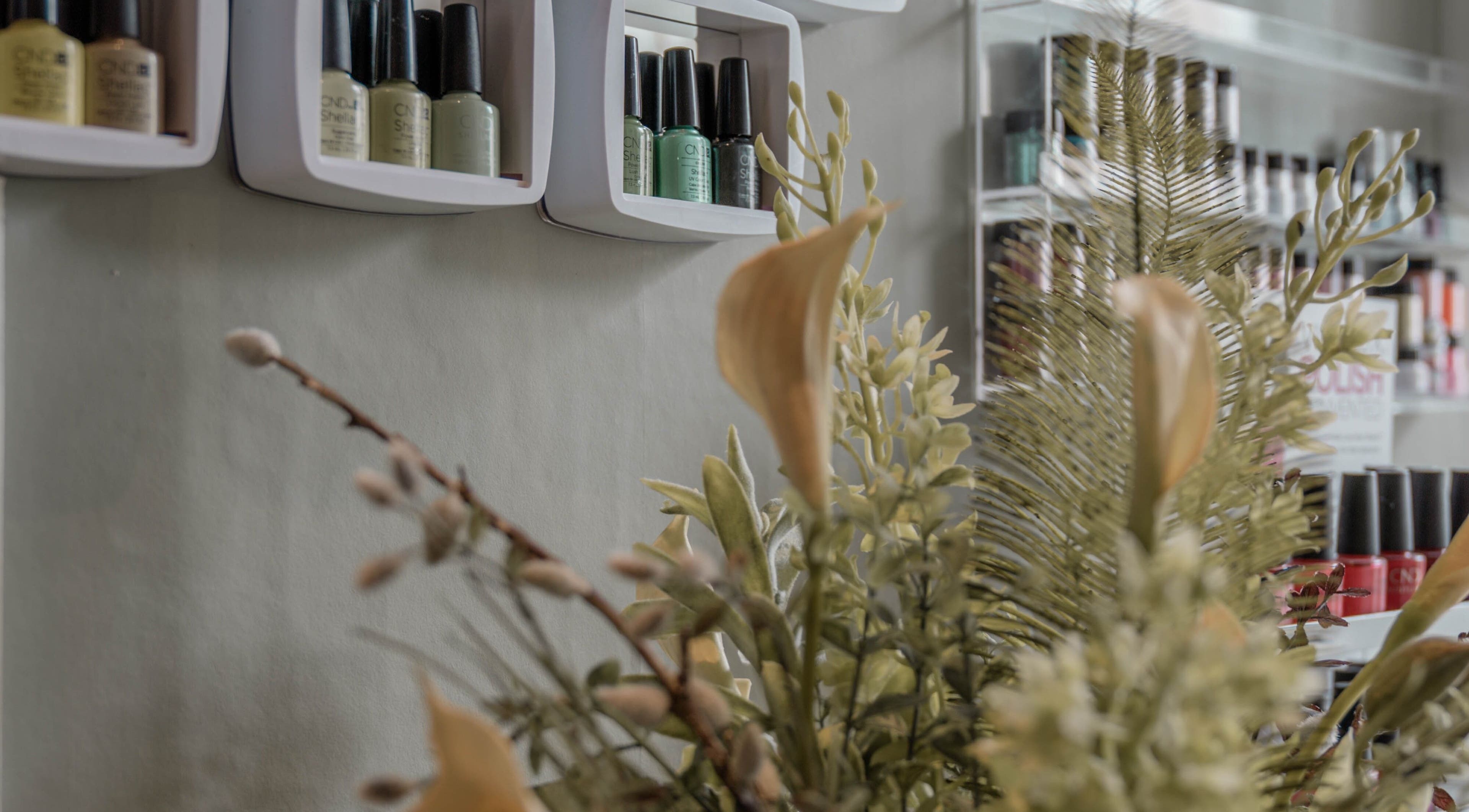 Nail polish and floral display at Kelly at Soul Self Care Clinic, Harrogate, England, GB.