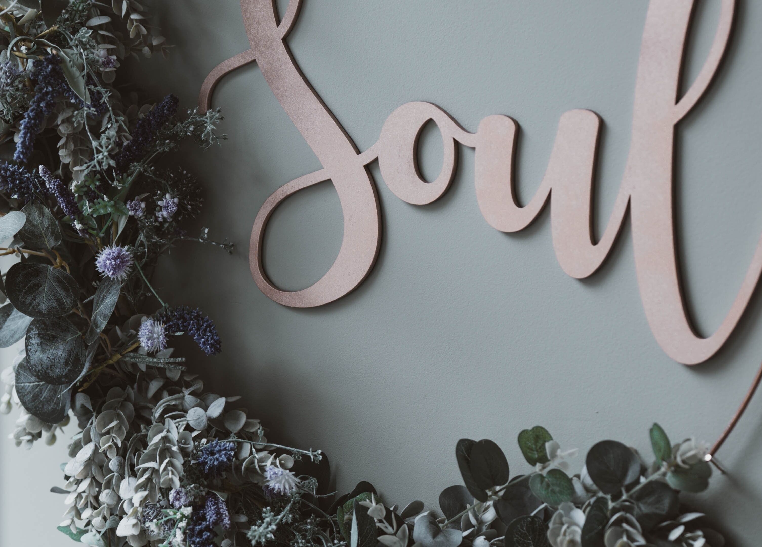 Floral decor with 'Soul' sign at Kelly at Soul Self Care Clinic in Harrogate, England, GB.