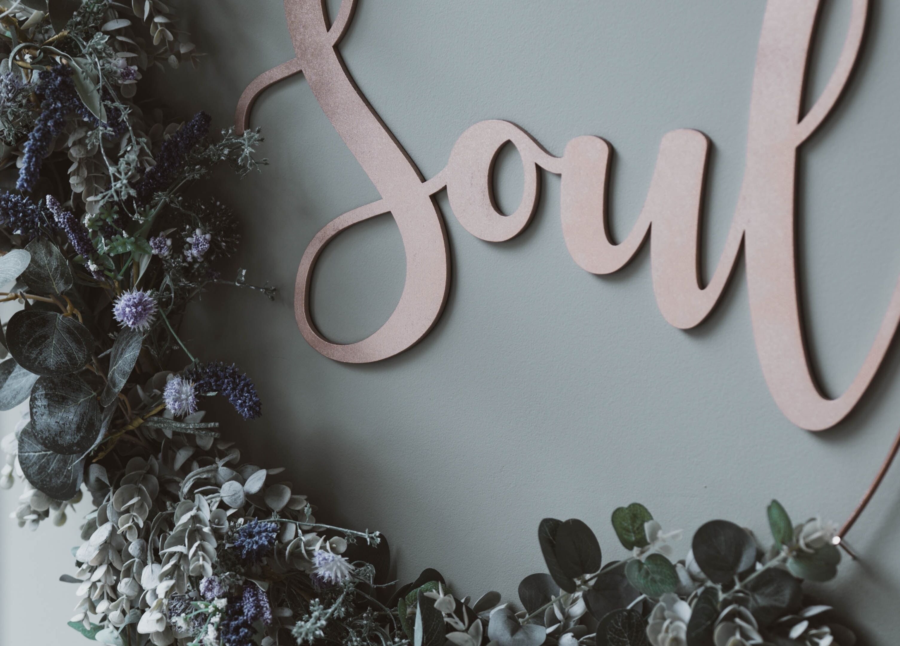 Floral decor with 'Soul' sign at Kelly at Soul Self Care Clinic in Harrogate, England, GB.