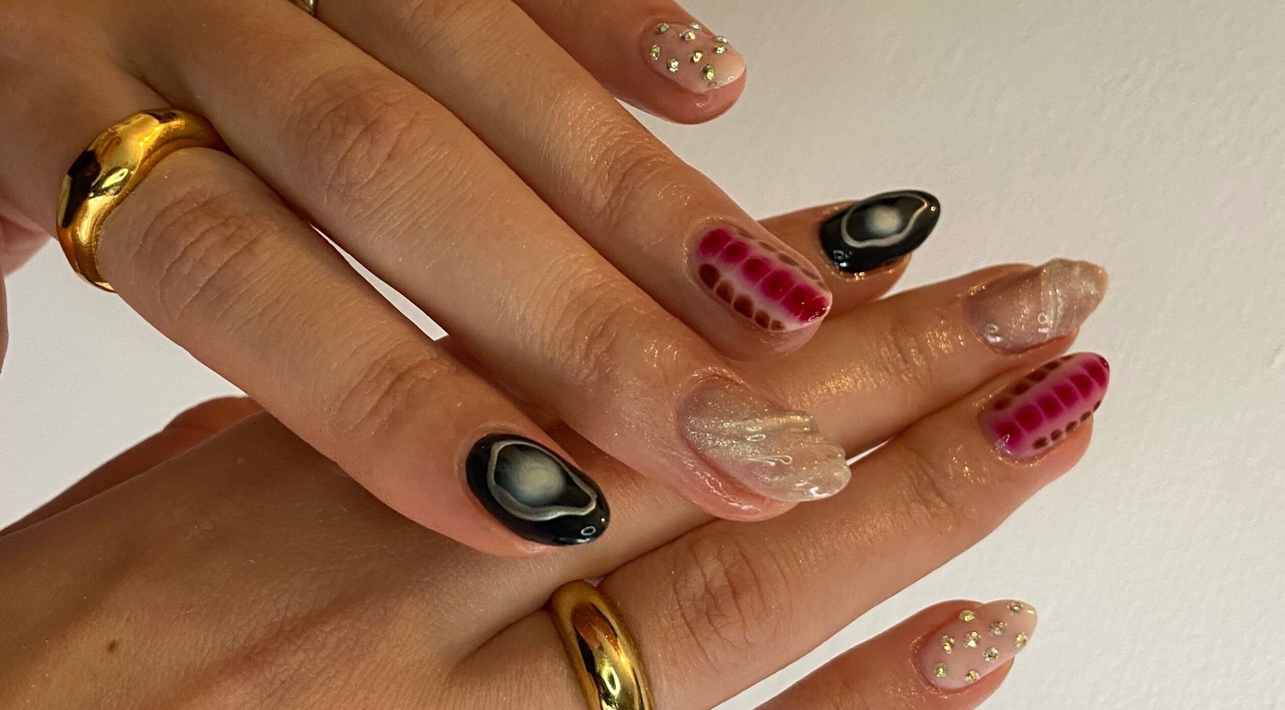Unique nail art by Leila Louella, Stockport, England, GB showcasing intricate designs and gold rings.