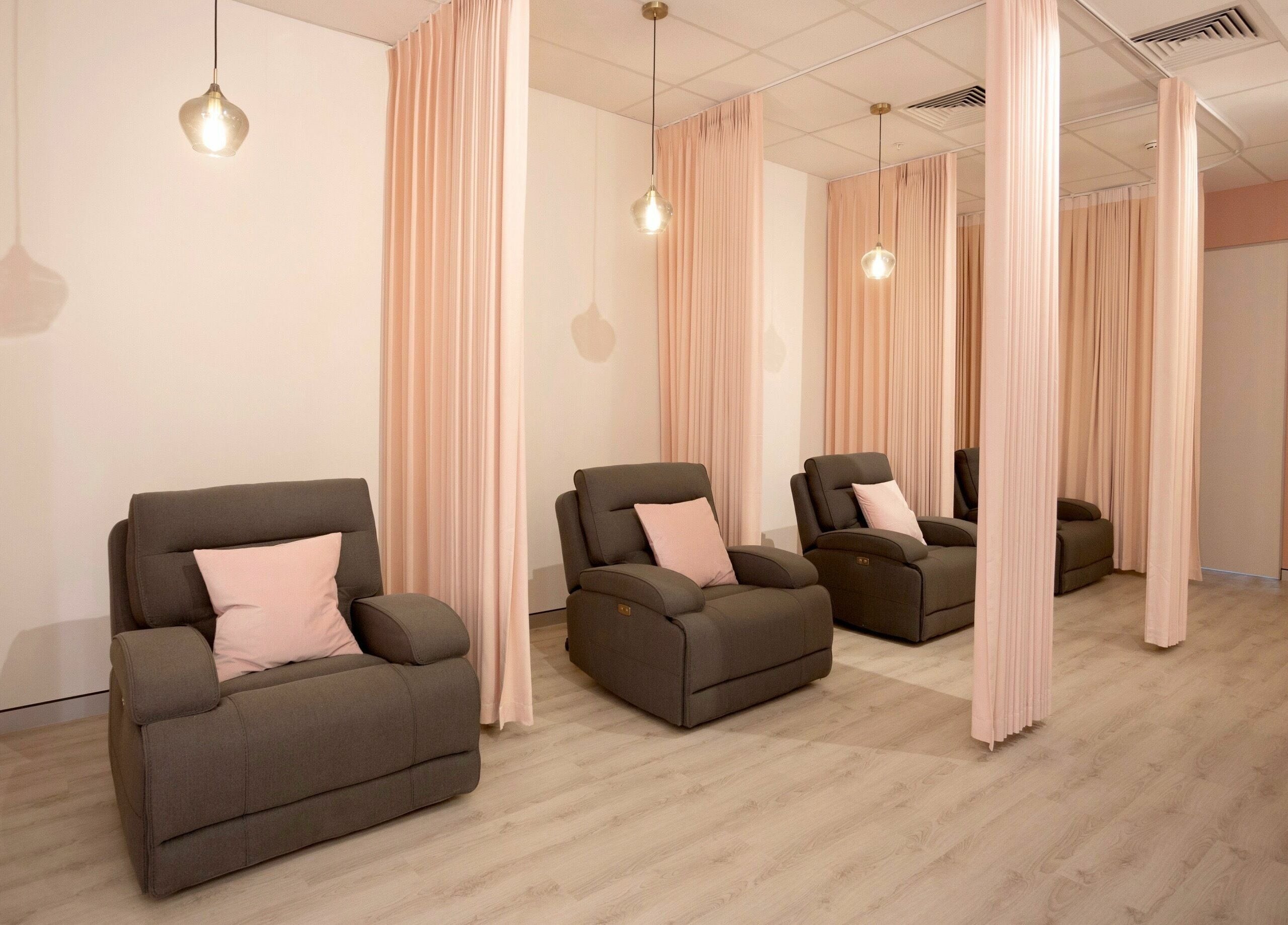 Relaxing lounge chairs with soft lighting at S&L Skins and Lashes, Burwood, New South Wales, AU.