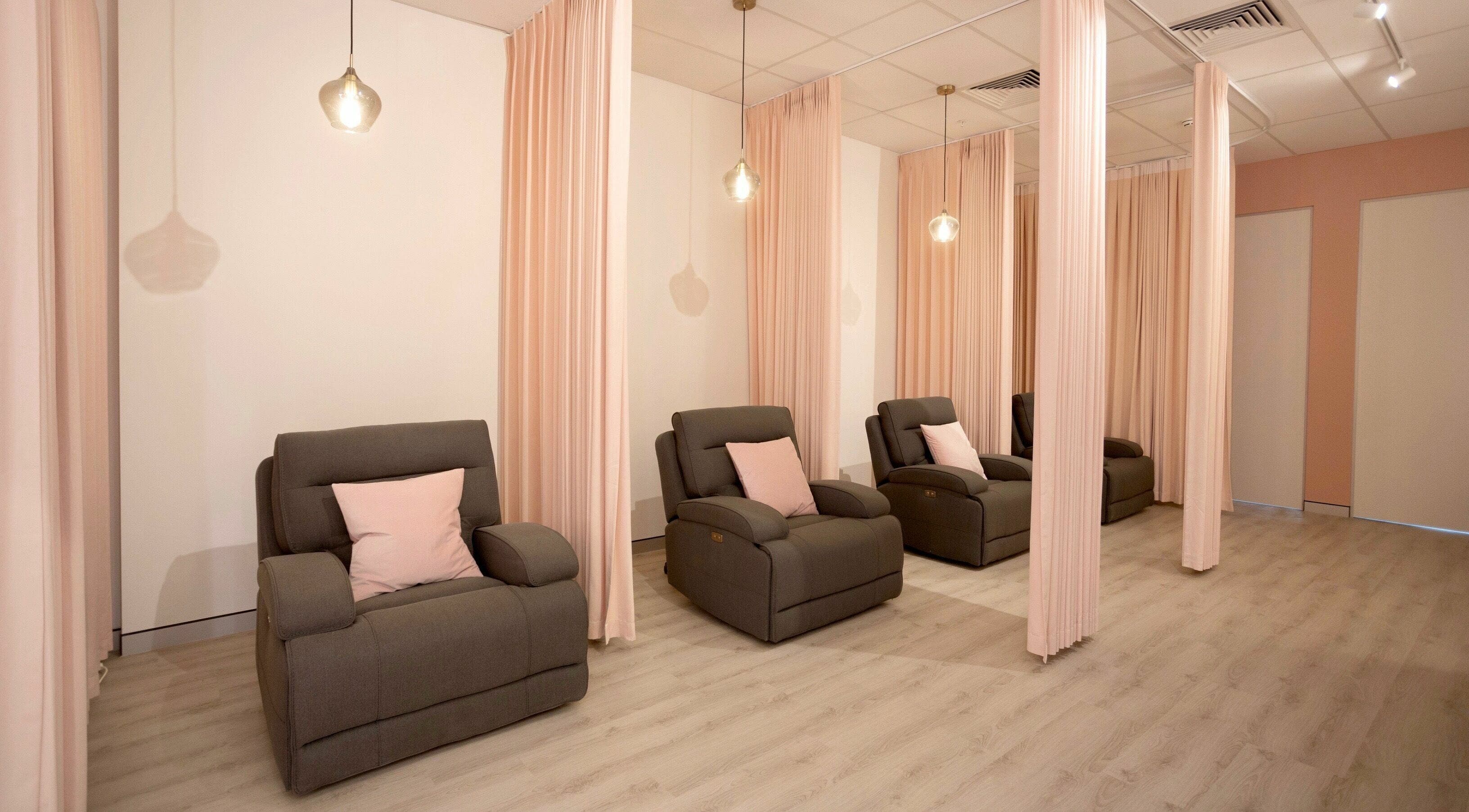 Relaxing lounge chairs with soft lighting at S&L Skins and Lashes, Burwood, New South Wales, AU.