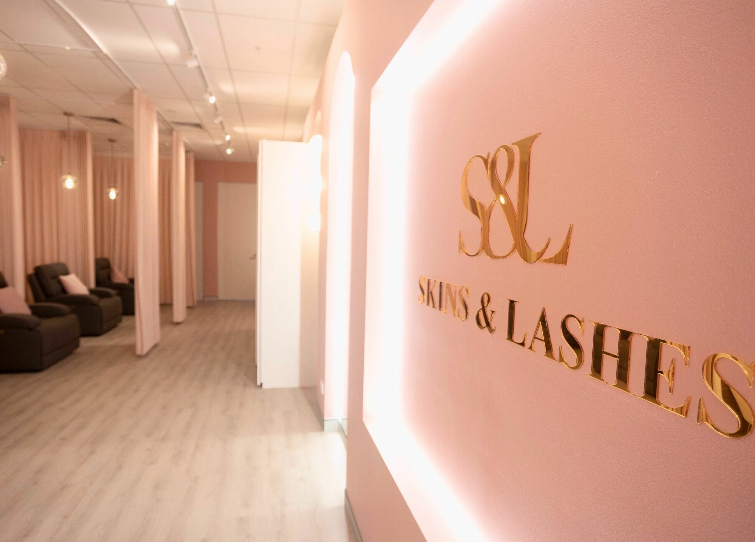Elegant interior of S&L Skins and Lashes in Burwood, New South Wales, AU, featuring relaxing seating and soft lighting.