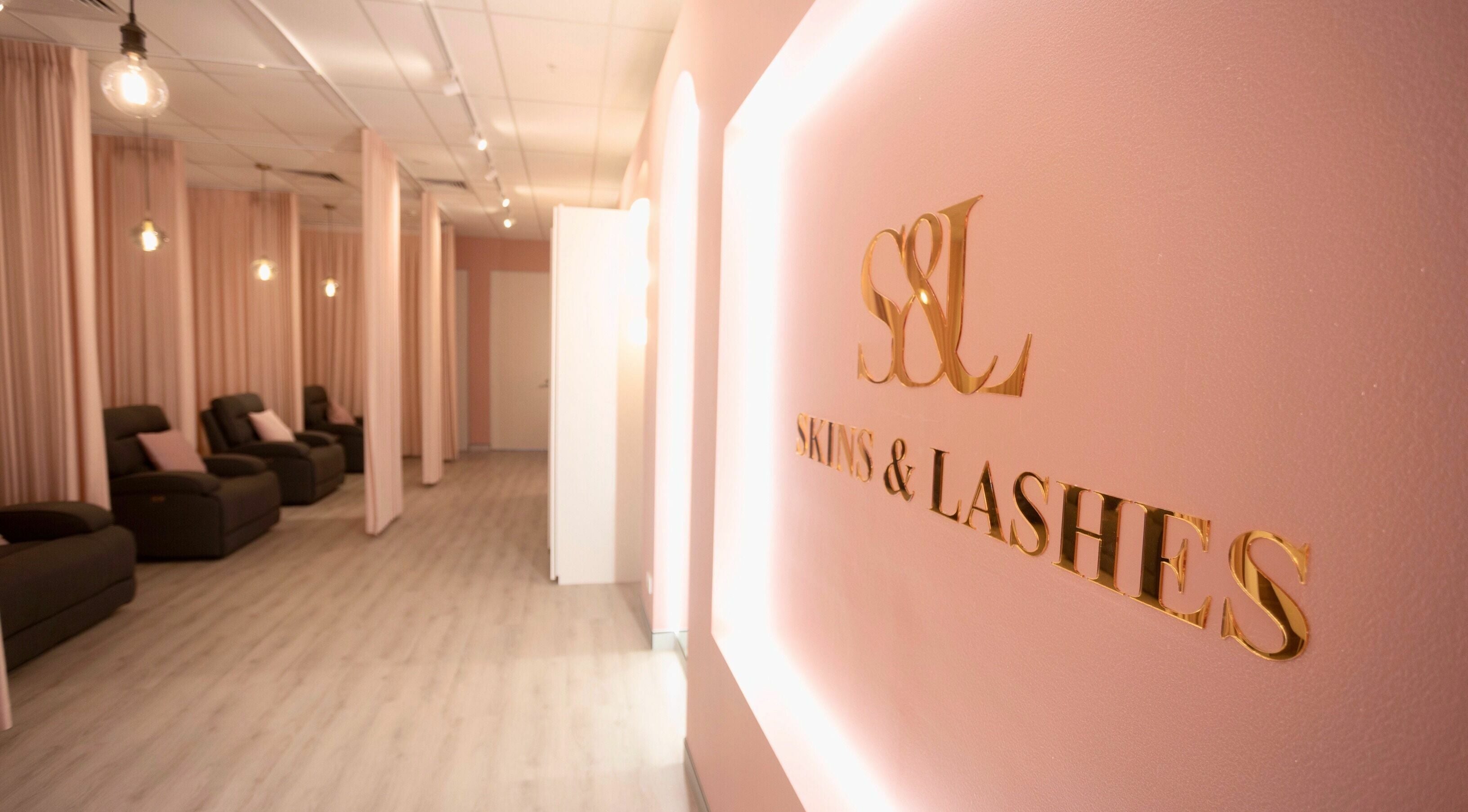 Elegant interior of S&L Skins and Lashes in Burwood, New South Wales, AU, featuring relaxing seating and soft lighting.