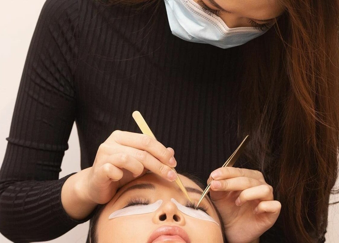 Expert applying lash extensions at S&L Skins and Lashes, Burwood, New South Wales, AU.